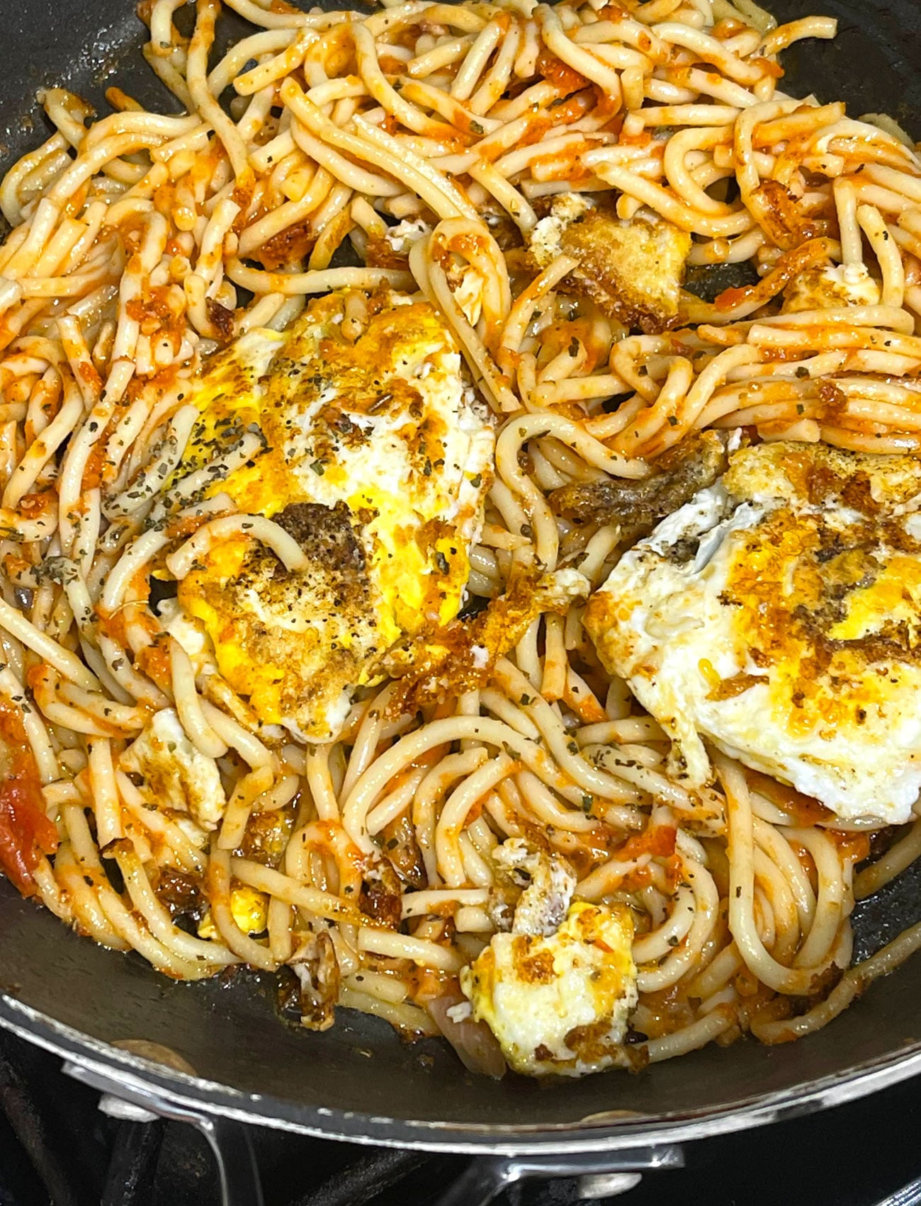 fried spaghetti with fried eggs