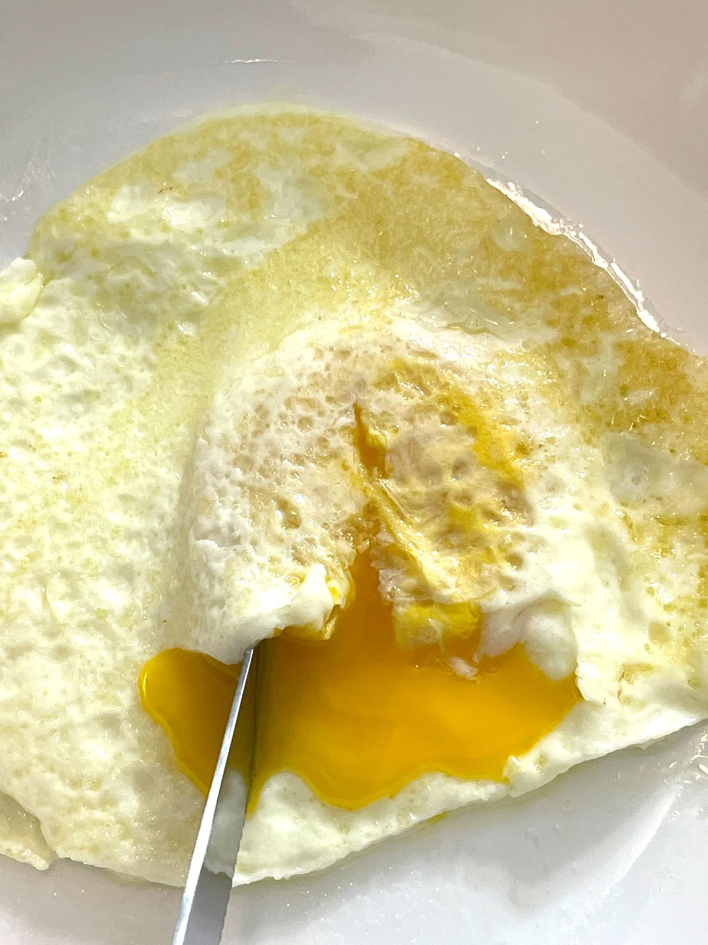 over easy fried eggs with runny yolks